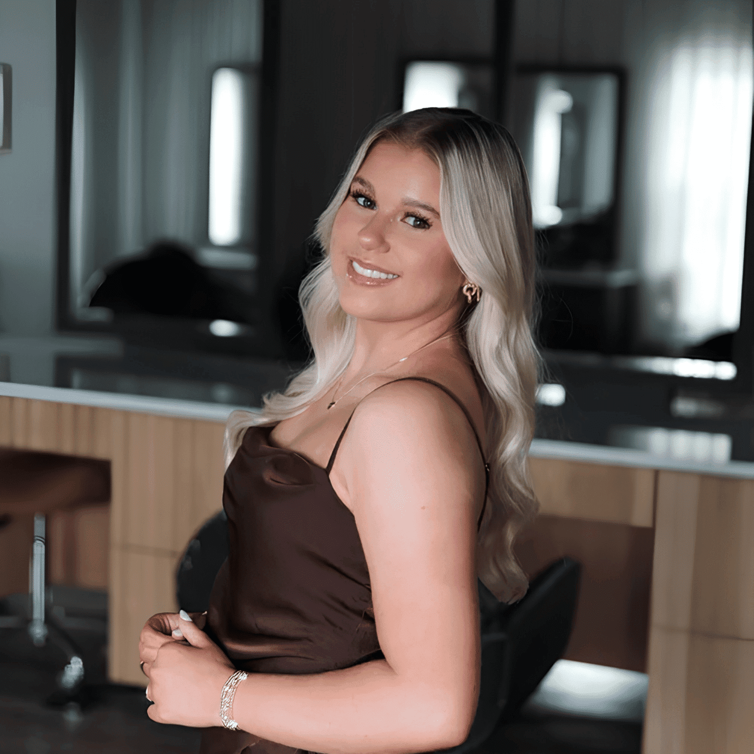 Portrait of Sloane Prince, a professional stylist at The Mane Atelier, showcasing their expertise and style.