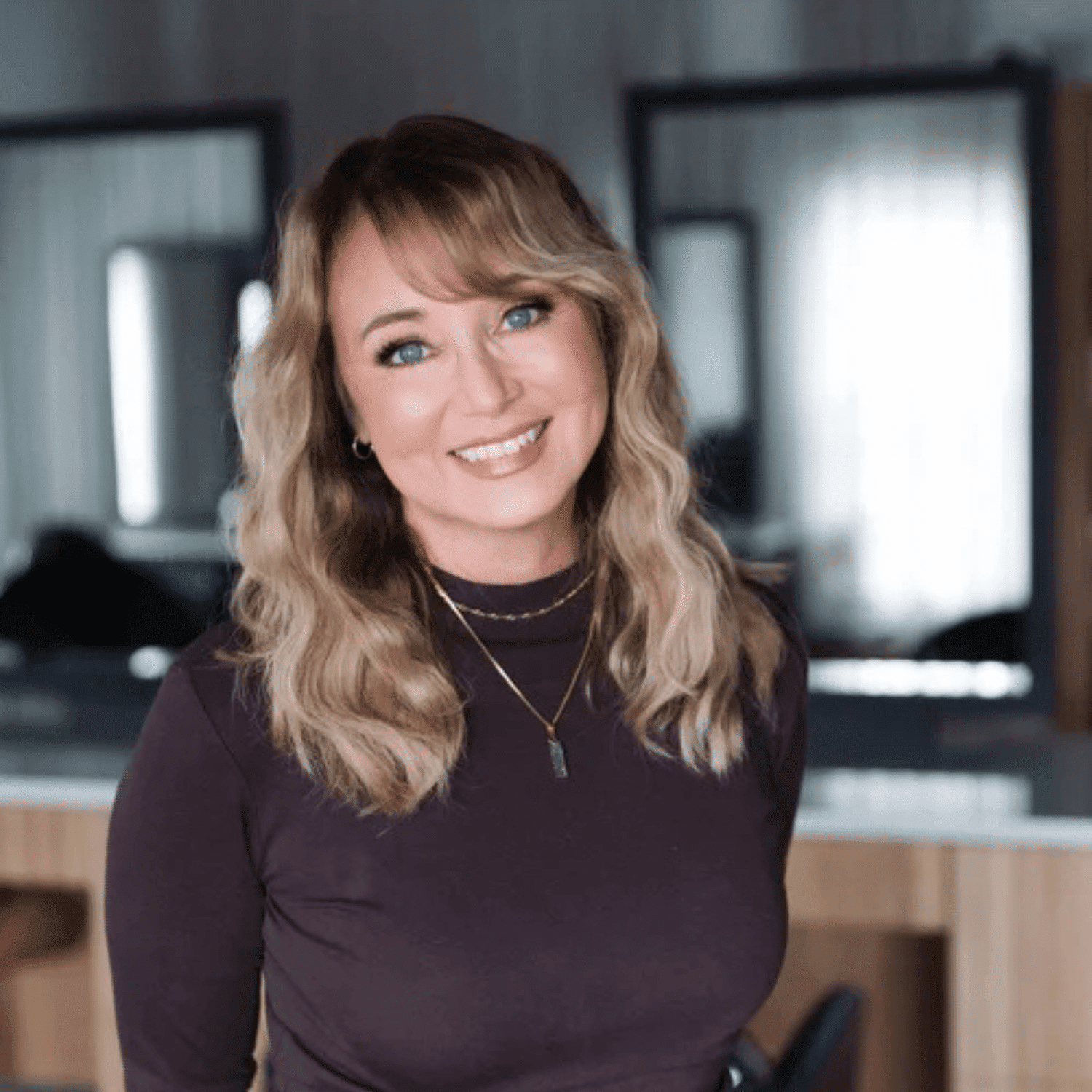Portrait of Tracey Deboer, a professional stylist at The Mane Atelier, showcasing their expertise and style.