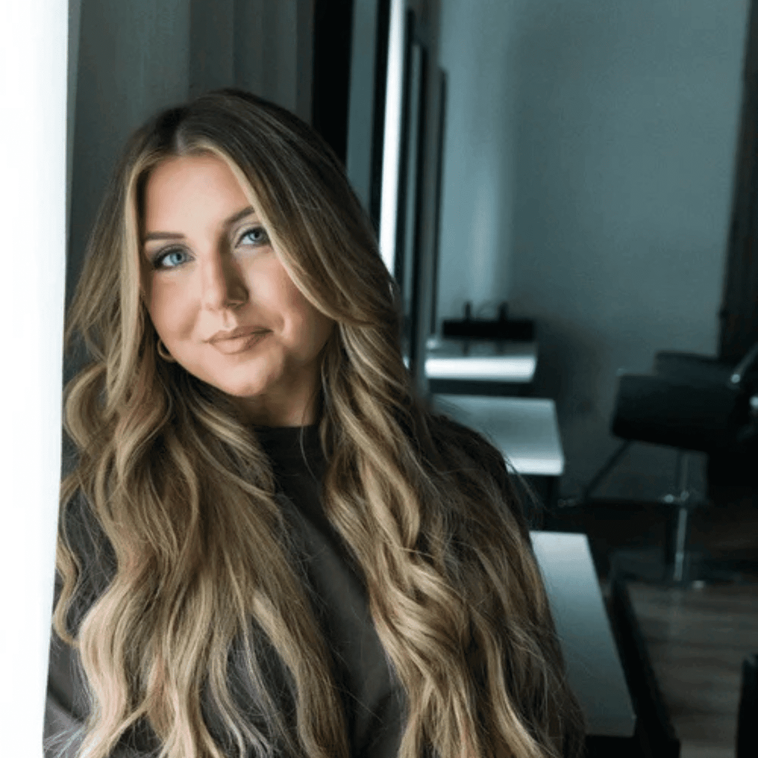 Portrait of Baylee Mathews, a professional stylist at The Mane Atelier, showcasing their expertise and style.